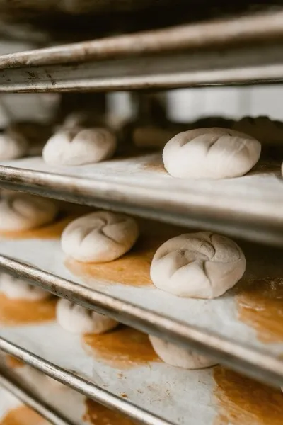 Dough rounds proofing on baking racks
