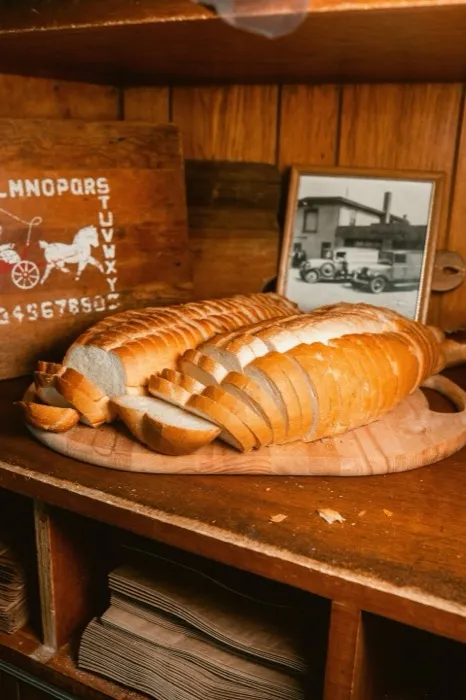 Sliced Italian loaf on a wooden board